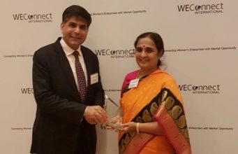 Ms. Ratna Prabha receiving an award for women entrepreneurship & empowerment